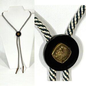 Black and gold-tone bolo tie with chief theme.